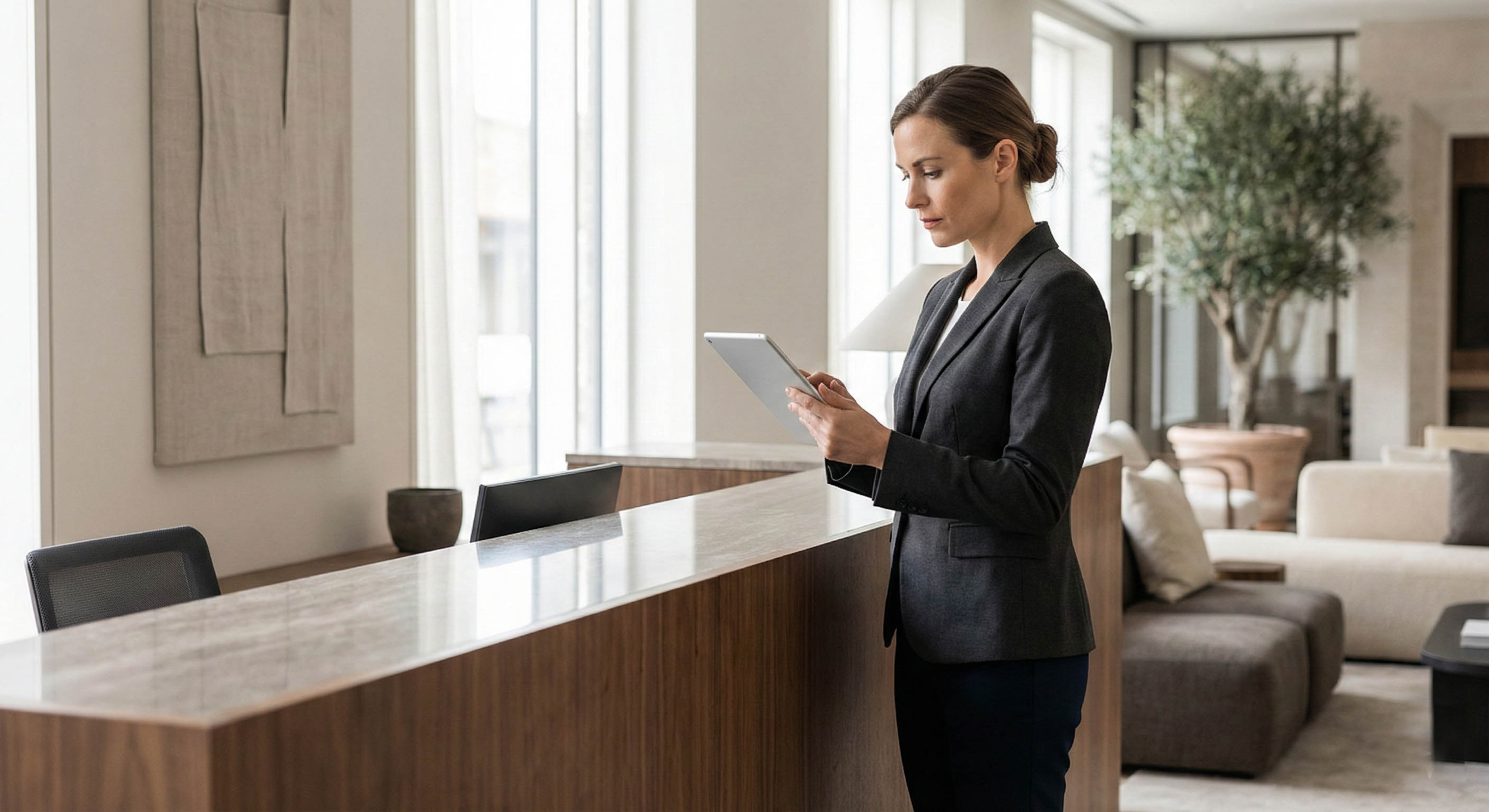 Hotel professional managing guest journey at reception